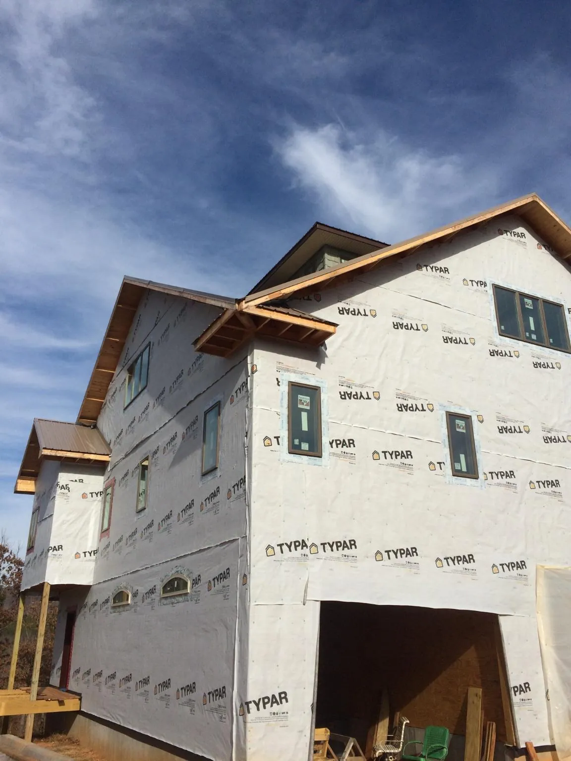 Stick built house wrapped in Typar with new roof framing and dormers in Fruita